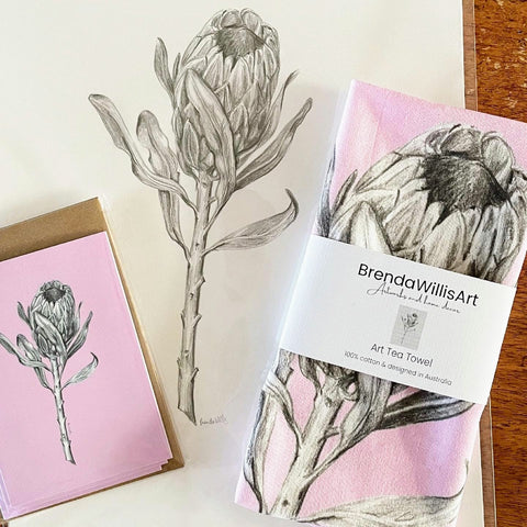 Protea art pink tea towel & pink card set. Floral graphite drawing artwork on 100% cotton and matching card
